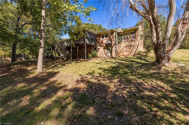 view of yard with a wooden deck