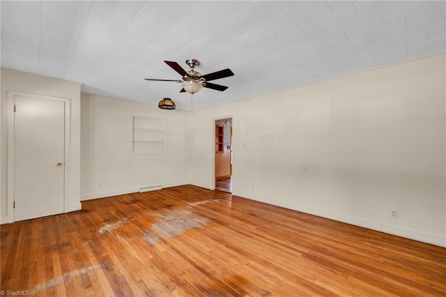 spare room with light hardwood / wood-style floors and ceiling fan