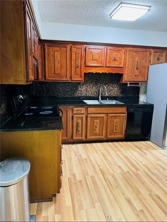 567 Townsend St, North Wilkesboro, NC 28659 - kitchen featuring black appliances, a sink, brown cabinetry, and a textured ceiling