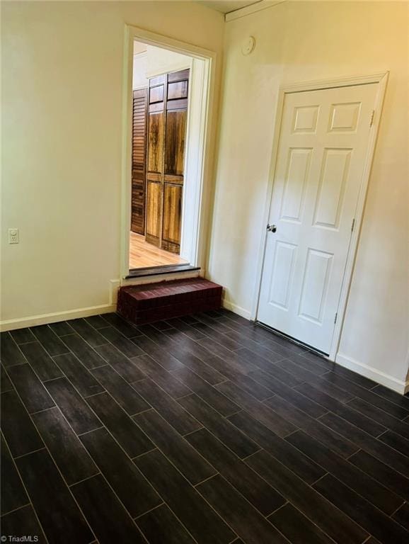 567 Townsend St, North Wilkesboro, NC 28659 - unfurnished room featuring baseboards and dark wood-type flooring