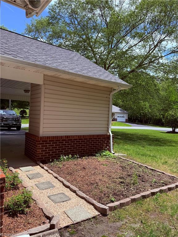1770 Inglebrook Trl, Mount Airy, NC 27030 - view of property exterior with a yard and a shingled roof