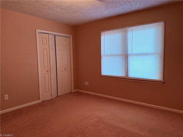 1770 Inglebrook Trl, Mount Airy, NC 27030 - unfurnished bedroom with a textured ceiling, light colored carpet, baseboards, and a closet