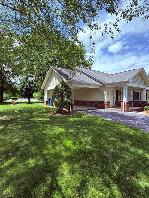 1770 Inglebrook Trl, Mount Airy, NC 27030 - ranch-style home featuring driveway, brick siding, a front yard, and roof with shingles