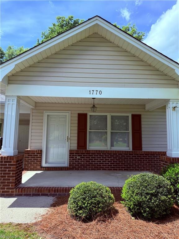 1770 Inglebrook Trl, Mount Airy, NC 27030 - view of front of home featuring covered porch and brick siding