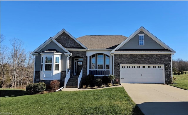 craftsman-style home with a front yard and a garage