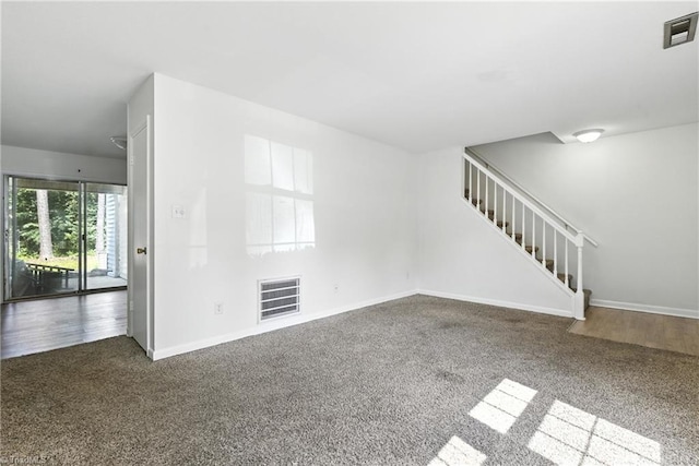 2711 Reynolds Park Rd, Winston-Salem, NC 27107 - unfurnished living room featuring carpet floors and stairs