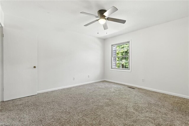 2711 Reynolds Park Rd, Winston-Salem, NC 27107 - carpeted spare room featuring baseboards and ceiling fan