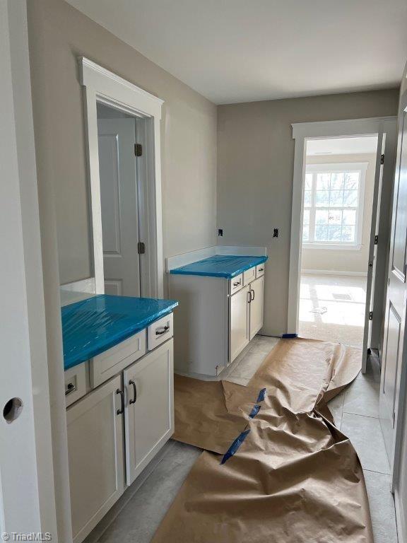 kitchen featuring white cabinets