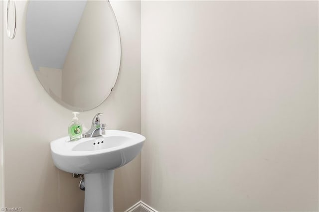 bathroom with baseboards