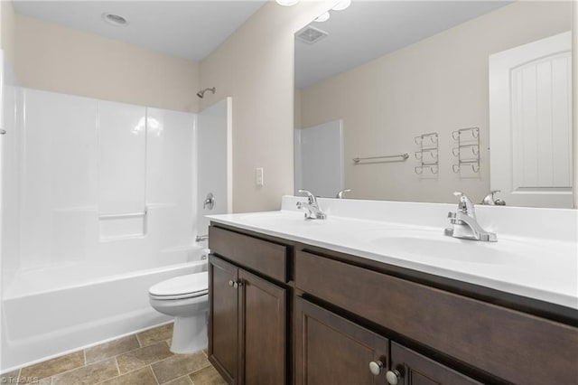 bathroom with a sink, shower / bath combination, toilet, and visible vents