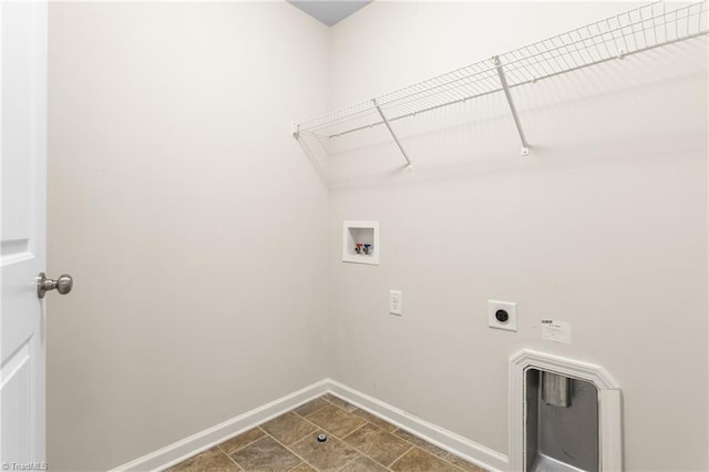 laundry room featuring laundry area, electric dryer hookup, washer hookup, and baseboards
