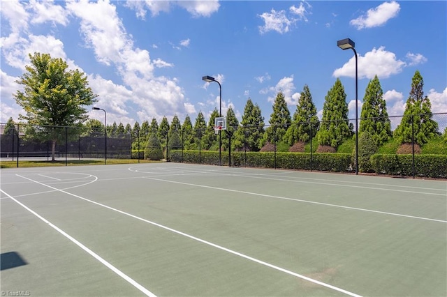 view of basketball court featuring community basketball court and fence