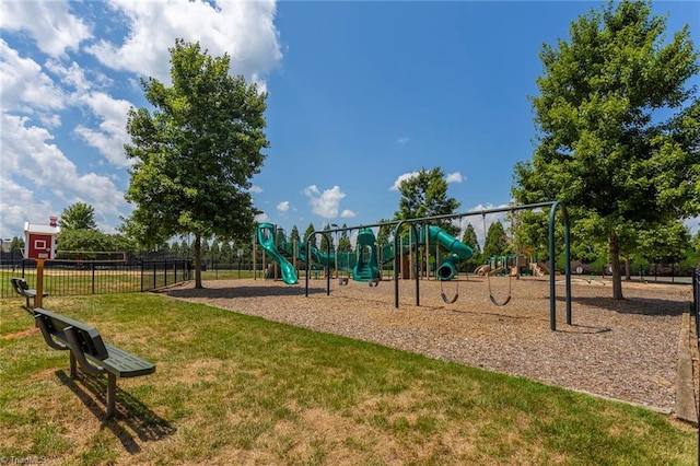 community playground with fence and a lawn