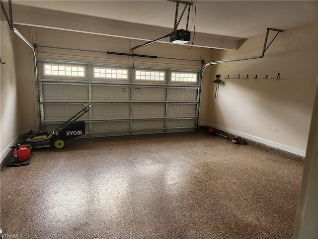 garage featuring baseboards and a garage door opener