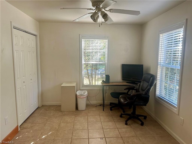 home office with ceiling fan and light tile patterned flooring