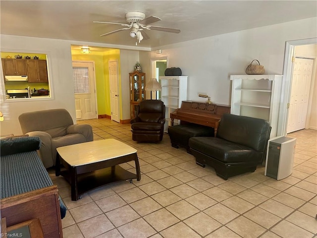 living room with ceiling fan and light tile patterned floors