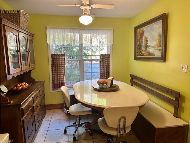 dining room with ceiling fan and light tile patterned floors