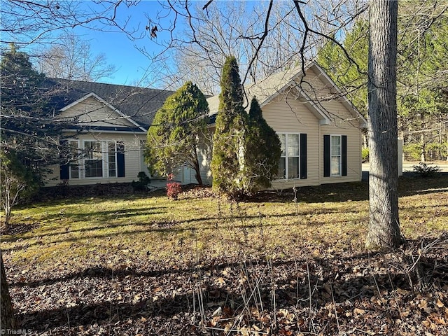 view of home's exterior with a lawn