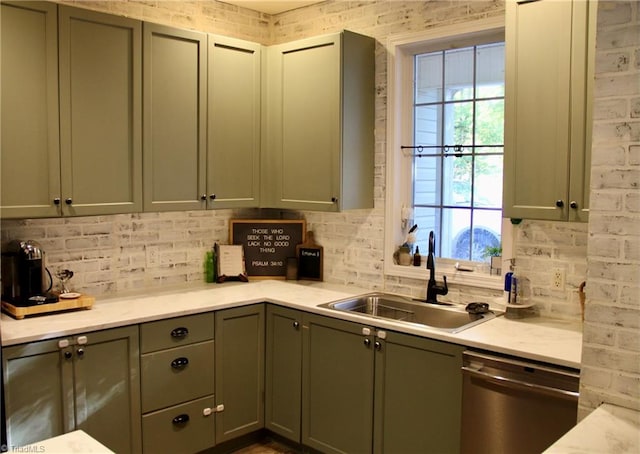 kitchen featuring dishwasher, plenty of natural light, backsplash, and sink