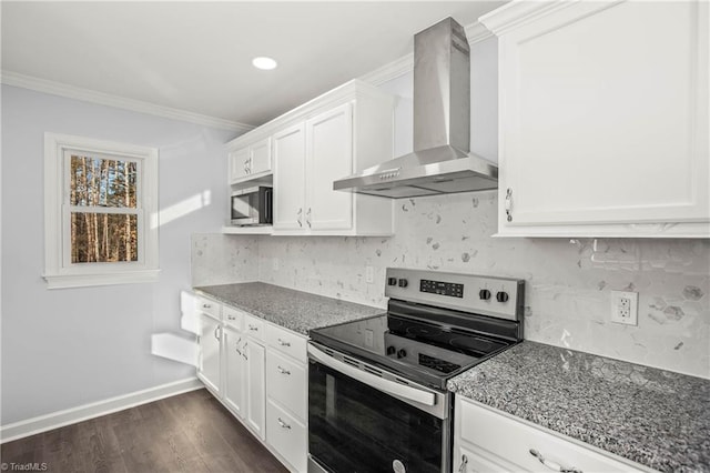 kitchen with stainless steel appliances, white cabinetry, light stone countertops, and wall chimney exhaust hood