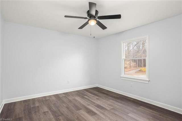 unfurnished room featuring ceiling fan and dark hardwood / wood-style floors