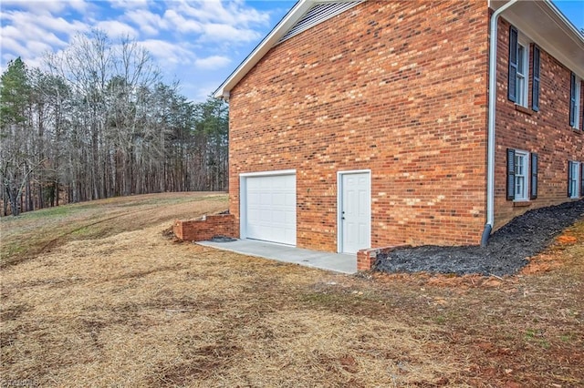 view of property exterior featuring a garage