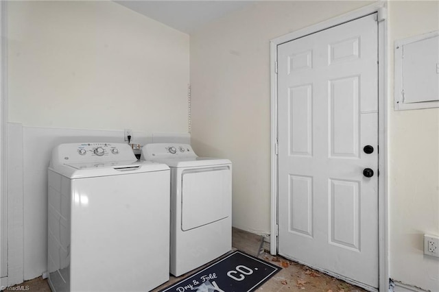 laundry area with electric panel and independent washer and dryer