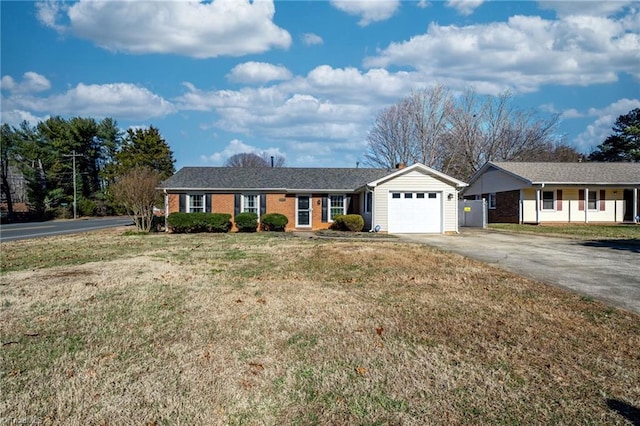 ranch-style home featuring a garage and a front yard