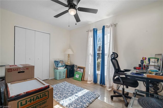 office area with ceiling fan and light wood-type flooring