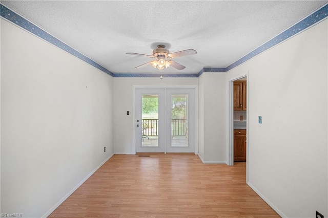 4904 Kacia Ct, Greensboro, NC 27407 - empty room featuring crown molding, baseboards, a textured ceiling, a ceiling fan, and light wood-style flooring