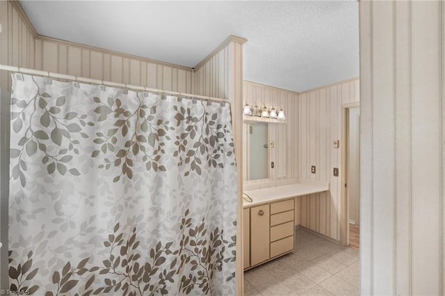 4904 Kacia Ct, Greensboro, NC 27407 - bathroom with vanity, curtained shower, wallpapered walls, a textured ceiling, and tile patterned floors