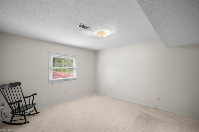 4904 Kacia Ct, Greensboro, NC 27407 - unfurnished room with visible vents, a textured ceiling, baseboards, and light carpet