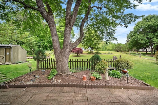 4904 Kacia Ct, Greensboro, NC 27407 - view of yard with an outdoor structure, a shed, and fence