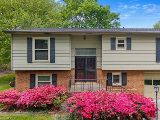 4904 Kacia Ct, Greensboro, NC 27407 - raised ranch with brick siding and an attached garage