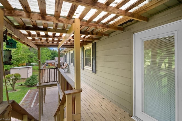 4904 Kacia Ct, Greensboro, NC 27407 - deck featuring an outdoor structure, a shed, and a pergola