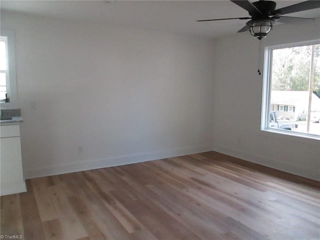 interior space featuring ceiling fan and light hardwood / wood-style flooring