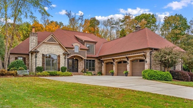 french country home with a front lawn