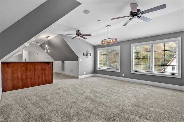 bonus room featuring lofted ceiling, light carpet, and ceiling fan