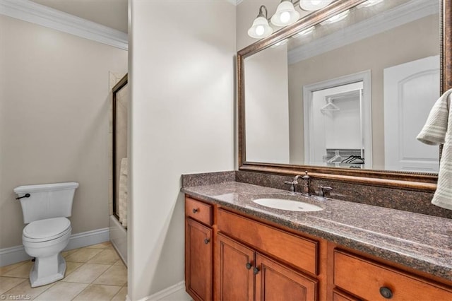 full bathroom with tile patterned floors, ornamental molding, enclosed tub / shower combo, vanity, and toilet