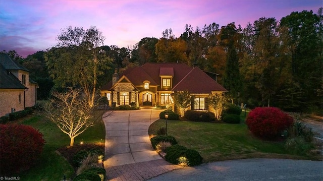 view of front of home with a lawn