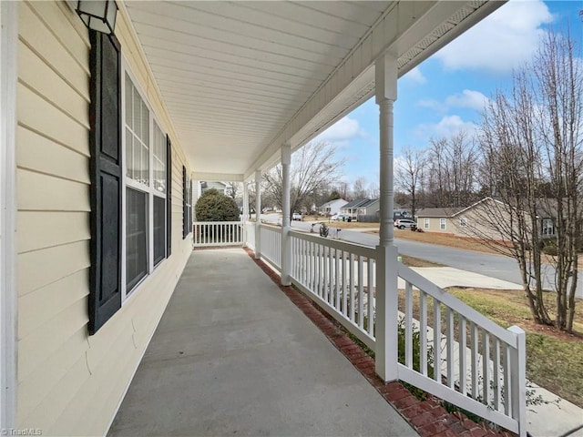 view of patio / terrace with covered porch and a residential view