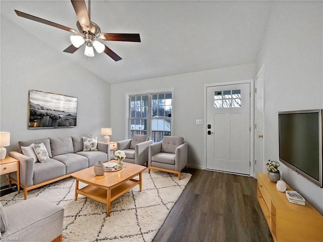 living area featuring dark wood-type flooring, a ceiling fan, and lofted ceiling