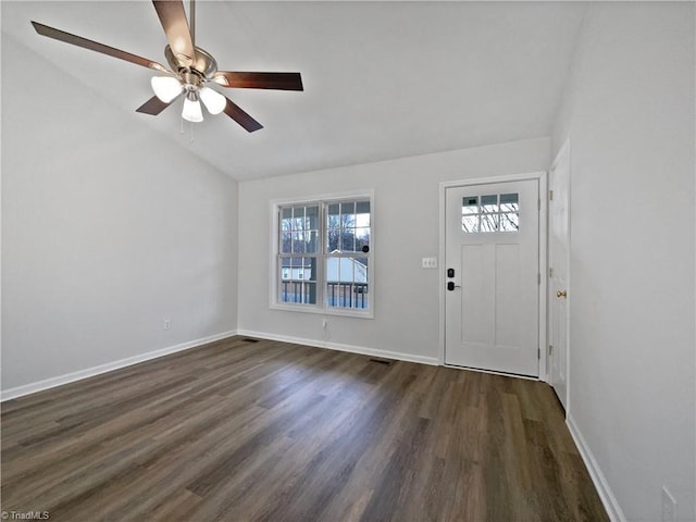 foyer featuring baseboards, lofted ceiling, dark wood finished floors, and a ceiling fan