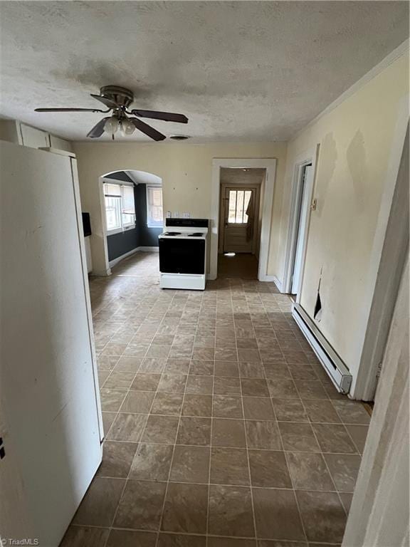 kitchen with a textured ceiling, ceiling fan, white appliances, and a baseboard heating unit