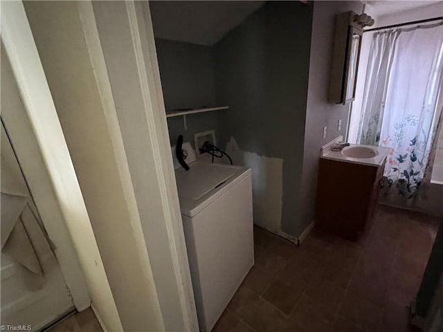 laundry room with sink and washer / dryer