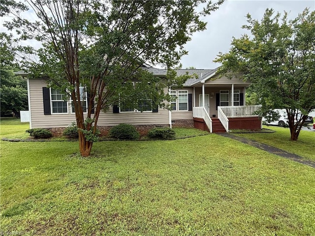 view of front of property with a porch and a front yard