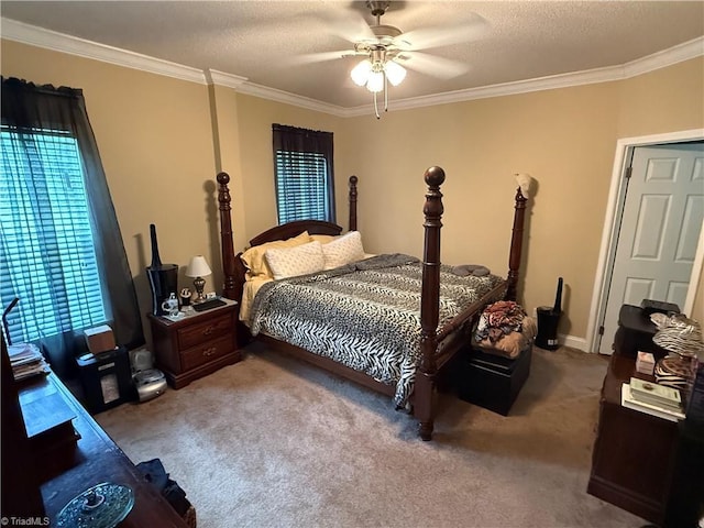 bedroom featuring ornamental molding, carpet floors, a ceiling fan, and a textured ceiling