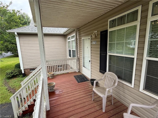 wooden terrace with a porch