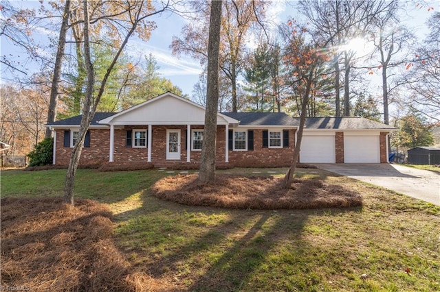 ranch-style home with a garage and a front yard