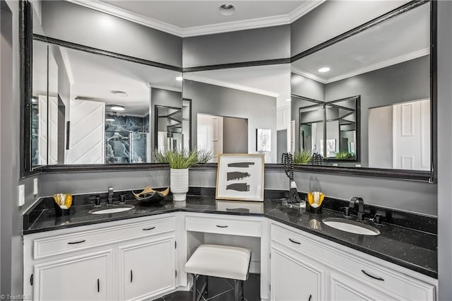 bathroom featuring ornamental molding and vanity